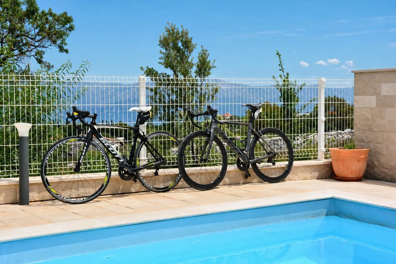 Bikes by the pool with a sea view