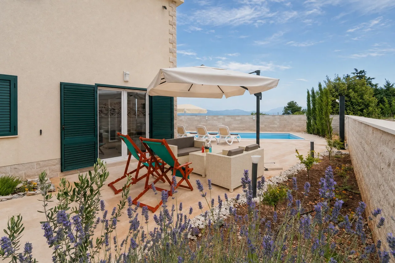 Terrace with lavender and loungers by the pool